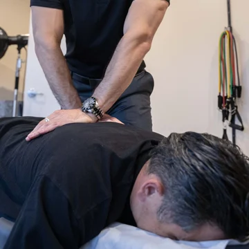 Chiropractor Torrance CA Jake Belabin Adjusting Back