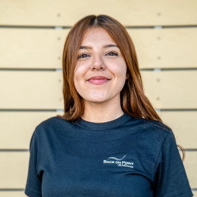 Chiropractic Torrance CA Britney Padilla 1 Britney Padilla smiling in a blue shirt.