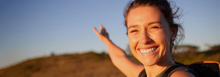 Chiropractic Torrance CA Happy Woman A woman outside smiling.