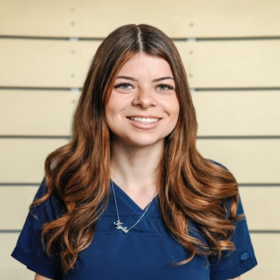 Chiropractic Torrance CA Kylie Smith 2 Kylie Smith smiling in a blue shirt.