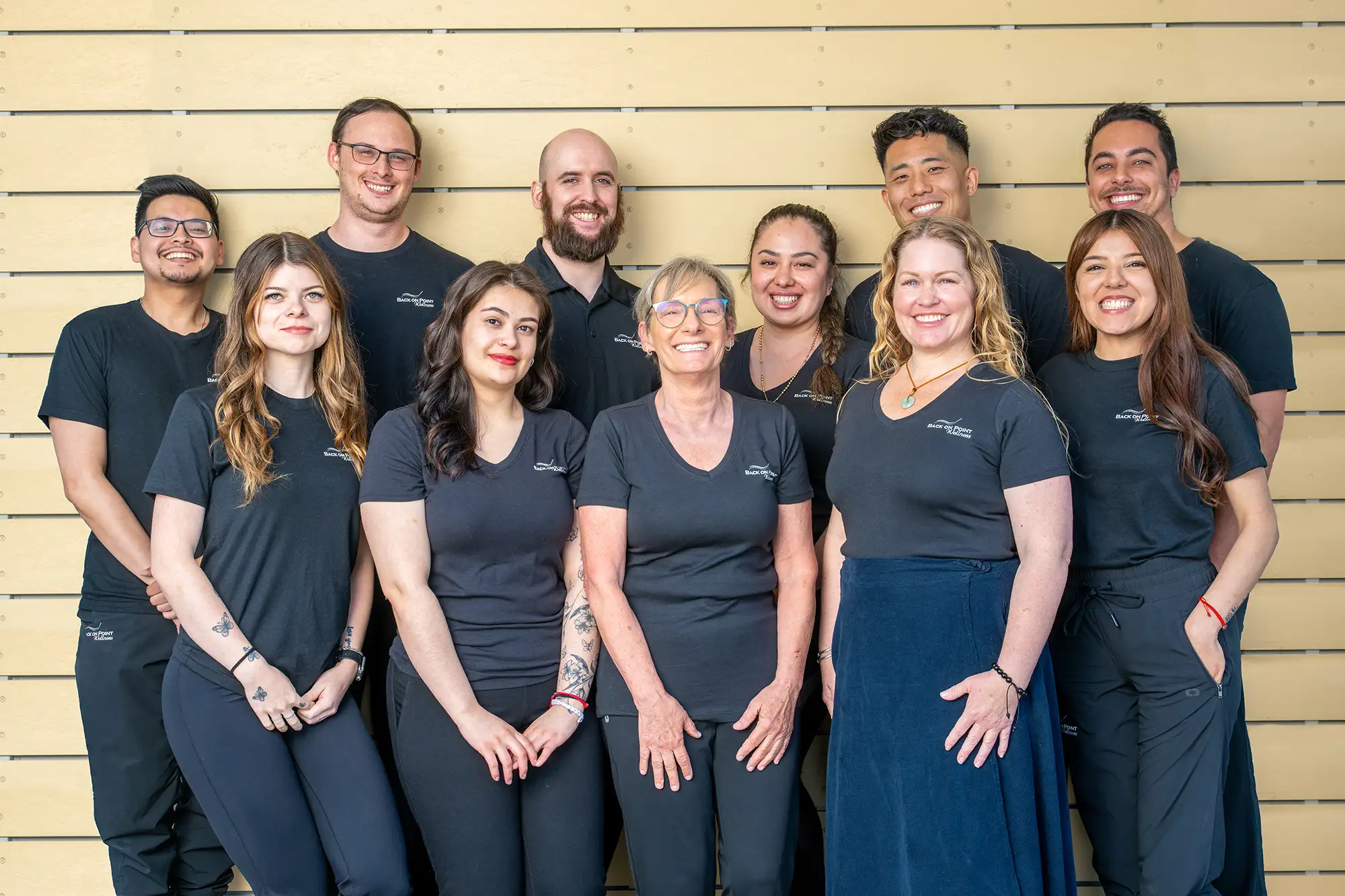 Chiropractor Torrance CA Ernest Kim, Reed Barnard, and Brian De Garmo With Team Homepage Ernest Kim, Reed Barnard, and Brian De Garmo smiling with their team.