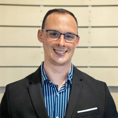 Chiropractor Torrance CA Reed Barnard 1 Reed Barnard smiling in a suit.