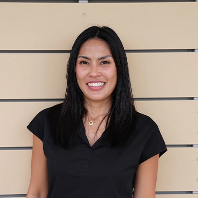 Massage Therapist Gade Songkaew In Front Of Wooden Wall